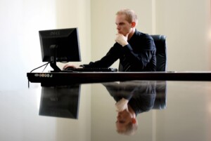 business coaches for entrepreneurs sat at a desk